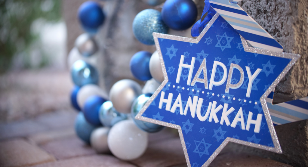 blue, silver, white balls with star of David stating Happy Hanukkah